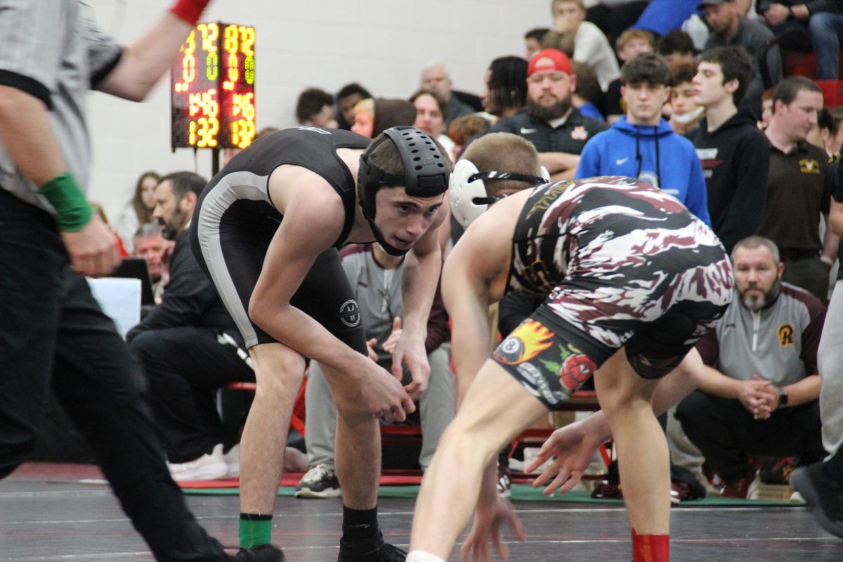 Junior Rayce Watson wrestles his opponent. 