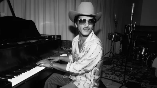 Bruno Mars poses at piano.
Photo courtesy of John V. Esparza from Atlantic Records