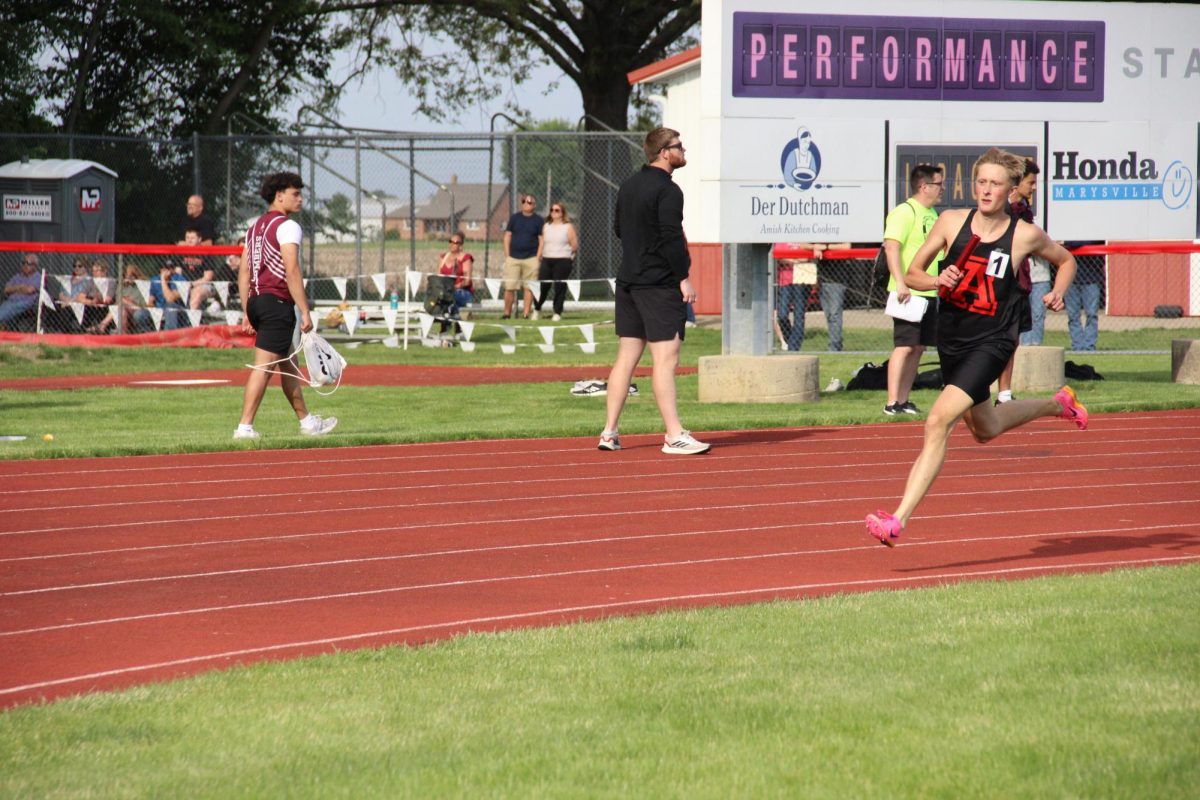 Senior Mark Goode runs the 4x8.