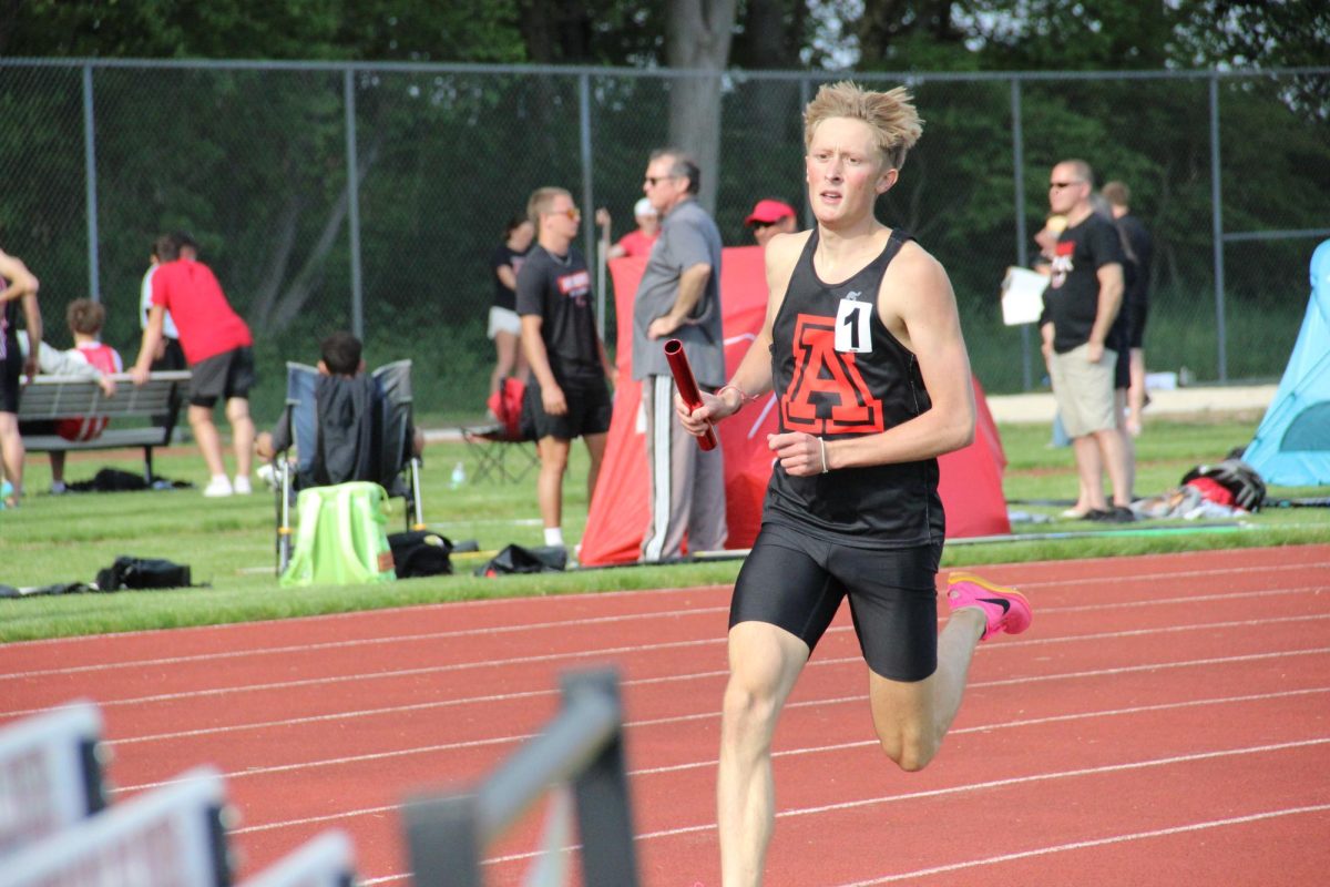 Senior Mark Goode runs the 4x8.