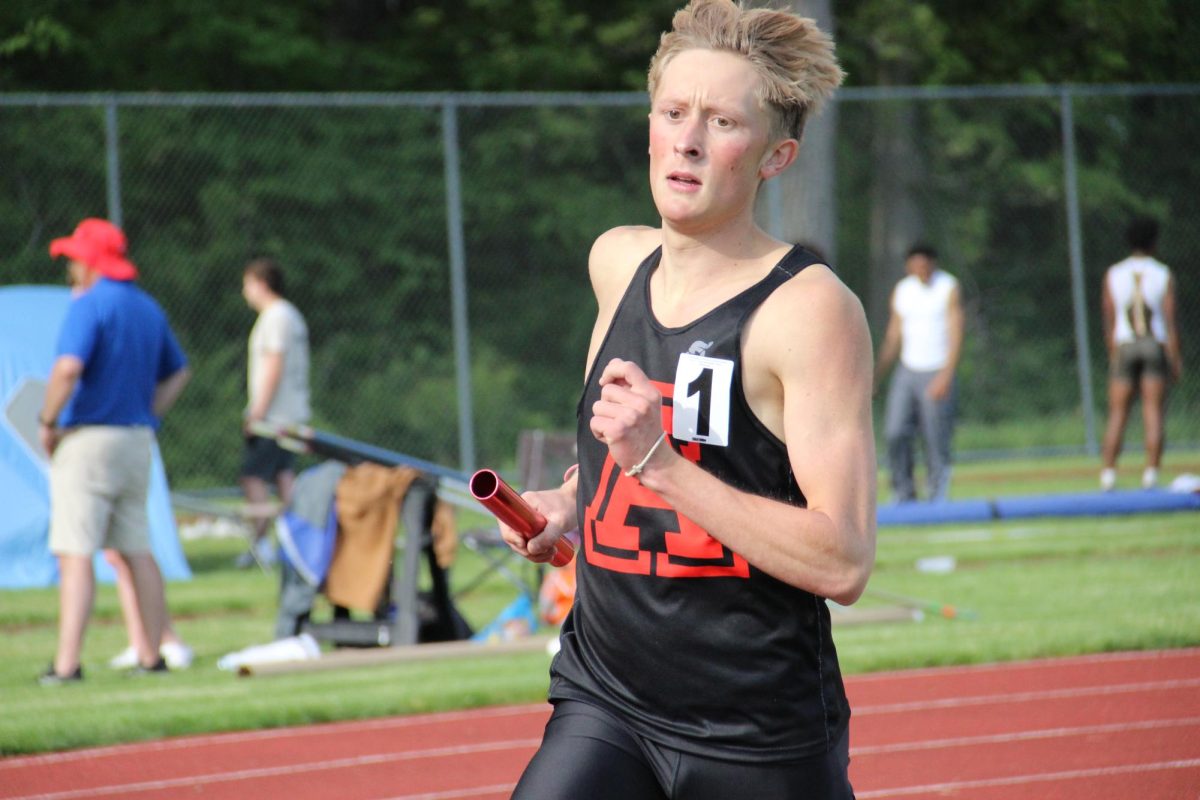 Senior Mark Goode runs the 4x8.