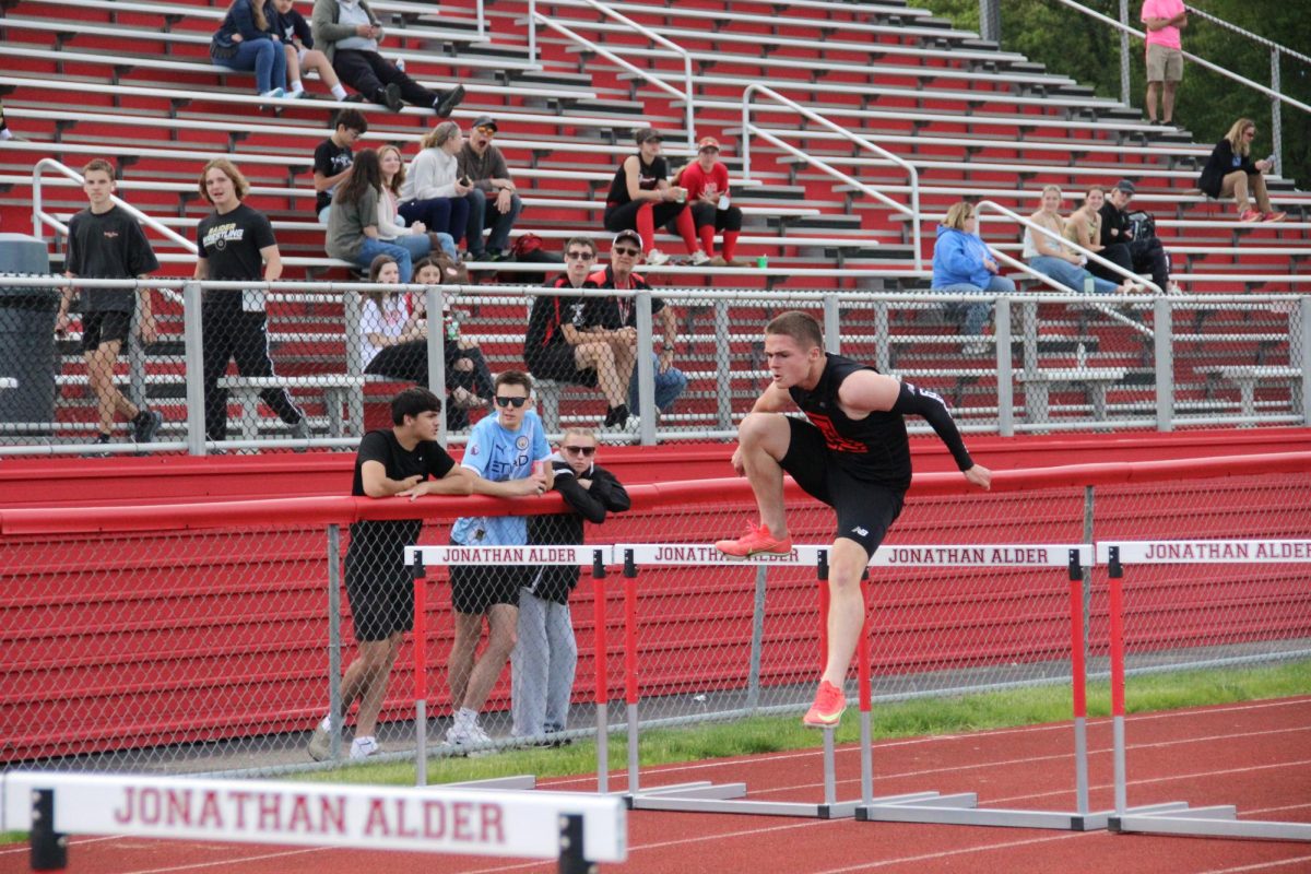 Freshman Ben Gordon runs the 110 meter hurdles.
