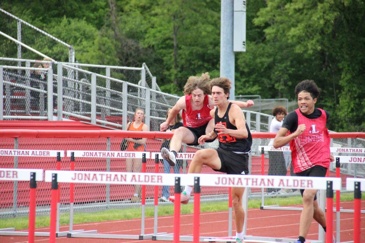 Junior Thomas Miller runs the 110 meter hurdles.