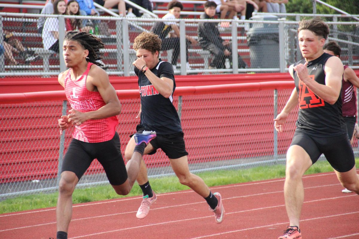 Sophomore Grayson Adams runs the 100 meter dash.