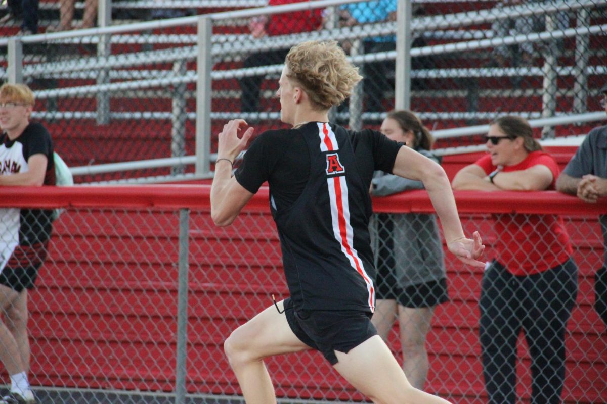 Freshman Kaden Rapp runs the 100 meter dash.